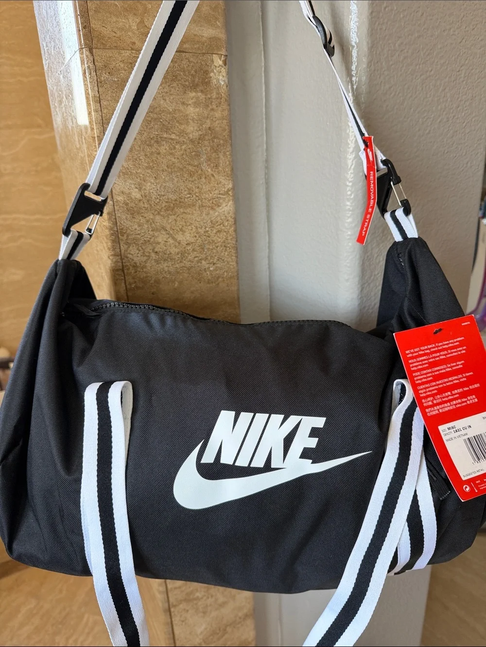 Nike Black Duffel Bag with White Swoosh and Striped Straps men’s gym sports